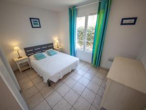 Katil atau katil-katil dalam bilik di Holiday Home Résidence Dune Blanche - Sable by Interhome