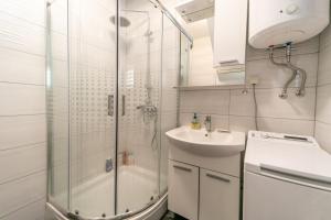 a bathroom with a shower and a sink at Vacation Home Katarina in Supetar +31 photos