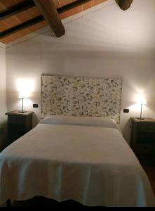 A bed or beds in a room at Agriturismo La Provenca