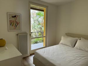 Postel nebo postele na pokoji v ubytování VILLA SAN VITO - Lake Como