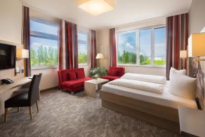 TV a/nebo společenská místnost v ubytování Best Western Hotel Dreiländerbrücke Weil am Rhein / Basel