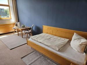 Postel nebo postele na pokoji v ubytování Hotel Garni