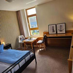 Postel nebo postele na pokoji v ubytování Hotel Garni