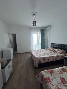 Letto o letti in una camera di My House Kvariati