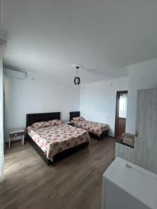 Letto o letti in una camera di My House Kvariati