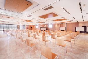 a large room with rows of chairs in it at AZZ Valencia Congress Hotel & Spa in Paterna
