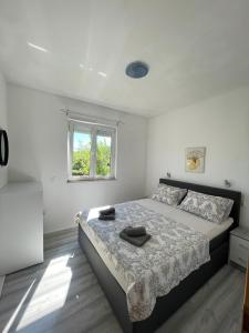 Postel nebo postele na pokoji v ubytování Apartmani Jure