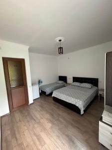 Letto o letti in una camera di My House Kvariati