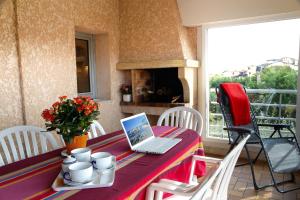 En balkon eller terrasse på Résidence d'Aquitaine