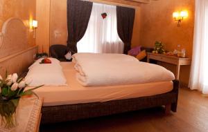 Postel nebo postele na pokoji v ubytování Bio Hotel Villa Cecilia