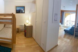 Postel nebo postele na pokoji v ubytování Appt dans chalet résidence Les Balcons du Soleil + 12 fotografií