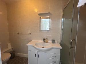 a bathroom with a sink and a shower at The Northdale Hotel Ltd in Skegness +37 photos