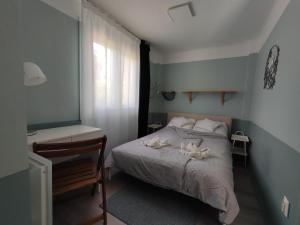 Posteľ alebo postele v izbe v ubytovaní Levélke Mini Apartman