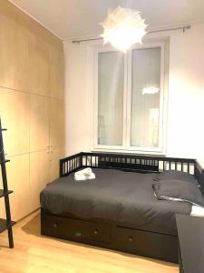 Ένα ή περισσότερα κρεβάτια σε δωμάτιο στο Bel appartement préfecture