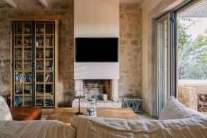 Postel nebo postele na pokoji v ubytování Riglia Villas - Villa Olive