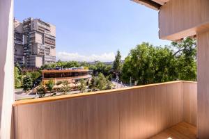 a view of a city from the balcony of a building at Шелковый Путь Премиум in Almaty