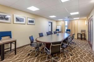 a conference room with a large table and chairs at Comfort Suites Near Denver Downtown in Denver