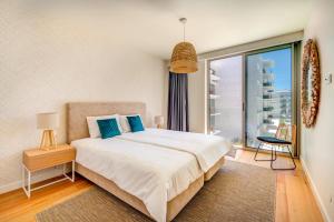 Ένα ή περισσότερα κρεβάτια σε δωμάτιο στο Apartment in the beautiful Bayline building - SPA - POOL - GYM - BEACH - Pargo BY BEDZY +19 φωτογραφίες