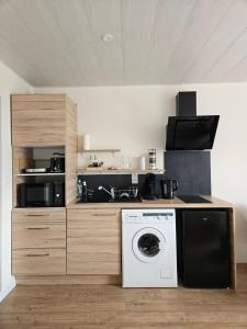 Kuchyň nebo kuchyňský kout v ubytování JURA Magnifique Studio Vacances 3 étoiles