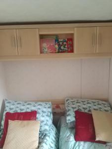 a small room with two pillows on a bed at Country retreat one in Gisburn
