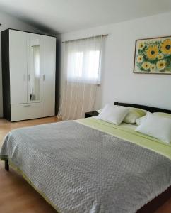 Postel nebo postele na pokoji v ubytování Apartman Skroza