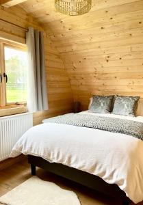 Ένα ή περισσότερα κρεβάτια σε δωμάτιο στο Orchard Hideaway, Bielby, York