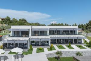 an aerial view of a large white building at Sani Gulf I & II in Sani Beach +38 photos