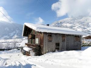 a small wooden building covered in snow at Holiday Home Geislerhütte by Interhome in Ramsau