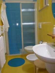 a bathroom with a shower and a toilet and a sink at Agriturismo Donna Clementina in Castellaneta Marina +48 photos