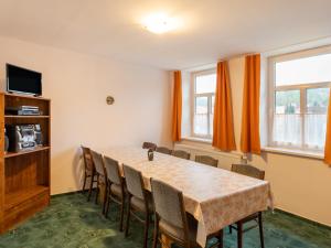 a dining room with a table and chairs at Apartment Base Camp 3 by Interhome in Šumburk nad Desnou +24 photos
