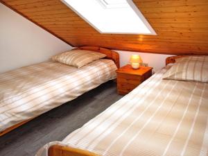 Postel nebo postele na pokoji v ubytování Holiday Home Altes Schöpfwerk-4 by Interhome