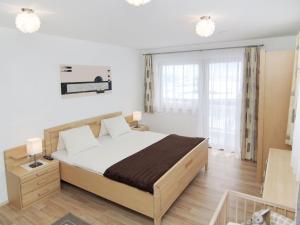a bedroom with a large bed in a room at Holiday Home Schiestl by Interhome in Ramsau