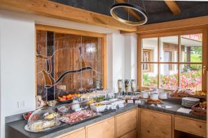 a kitchen with a counter with food on it at Garni Marianne in Malles Venosta