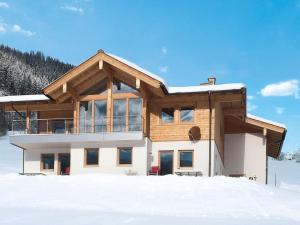 a house in the snow in the winter at Apartment Talmoosen-Bauer by Interhome in Dorf