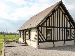 a barn conversion with a black and white building at Holiday Home La Prairie by Interhome in Corbon
