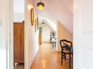a hallway of a home with white walls and wooden floors at Holiday Home La Lucerie by Interhome in Bretteville-sur-Ay