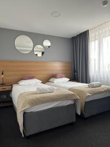 Łóżko lub łóżka w pokoju w obiekcie Gold Hotel