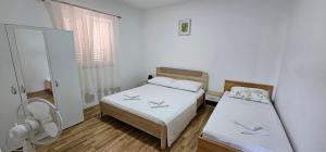 Katil atau katil-katil dalam bilik di Apartman Darko