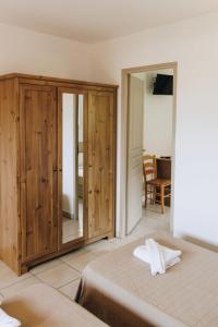 Ένα ή περισσότερα κρεβάτια σε δωμάτιο στο Apartment Club Benista T3 by Interhome