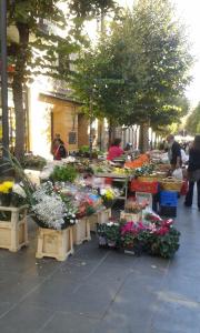 a flower market with flowers on a sidewalk at Da Anita in Rome
