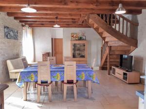 a kitchen and dining room with a table and chairs at Holiday Home Le Causse du Cluzel by Interhome in Pontcirq