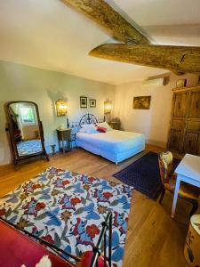 En eller flere senge i et værelse på Le Petit Palais Hors Du Temps