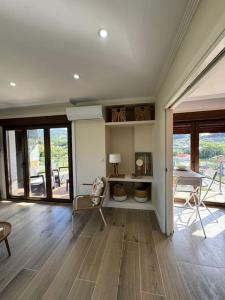 a large living room with a table and chairs at Vivienda junto a la playa de Loira in Seixo