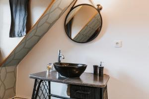 a bathroom with a sink and a mirror on the wall at La Villa in Mesnil-Val-Plage +39 photos