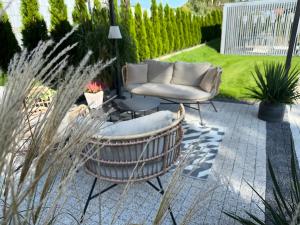 Zahrada ubytování WILLA MAGNOLIA - Apartamenty i Pokoje - ROWERY, POKÓJ ZABAW, KAWA Z EKSPRESU