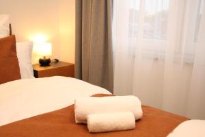 Ένα ή περισσότερα κρεβάτια σε δωμάτιο στο LV Apartment