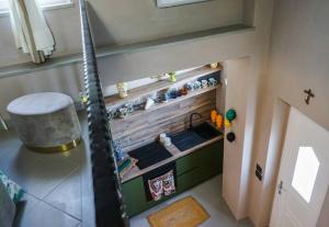 an overhead view of a kitchen with a sink at La Finestra sul Castello in Ischia +42 photos