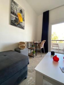 a living room with a couch and a table at Nıcosıa lefkosa brand new renovated 1 bedroom 3A in Yenişehir