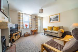 Televiisor ja/või meelelahutuskeskus majutusasutuses Seaside Cottage