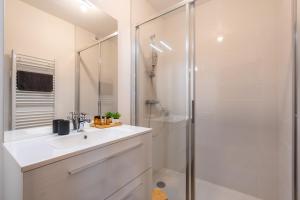 a white bathroom with a sink and a shower at Appartement standing "Ouréa" pour 8 personnes, navette 100m in Saint-Jean-de-Sixt +21 photos